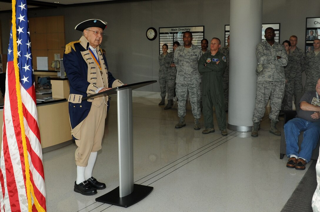 Retired U.S. Air Force Maj. Frank Jackson, Heroes of ‘76 member, delivers  the “Old Glory Speaks” program in honor of Flag Day at Langley Air Force Base, Va., June 14, 2011. Jackson spoke of the flag embracing those who have not returned home, their purity remembered in the stripes of white, their blood in the stripes of red, their souls cradled in the stars, and their courage embedded in the blue. (U.S. Air Force photo by Airman 1st Class Racheal Watson/Released)
