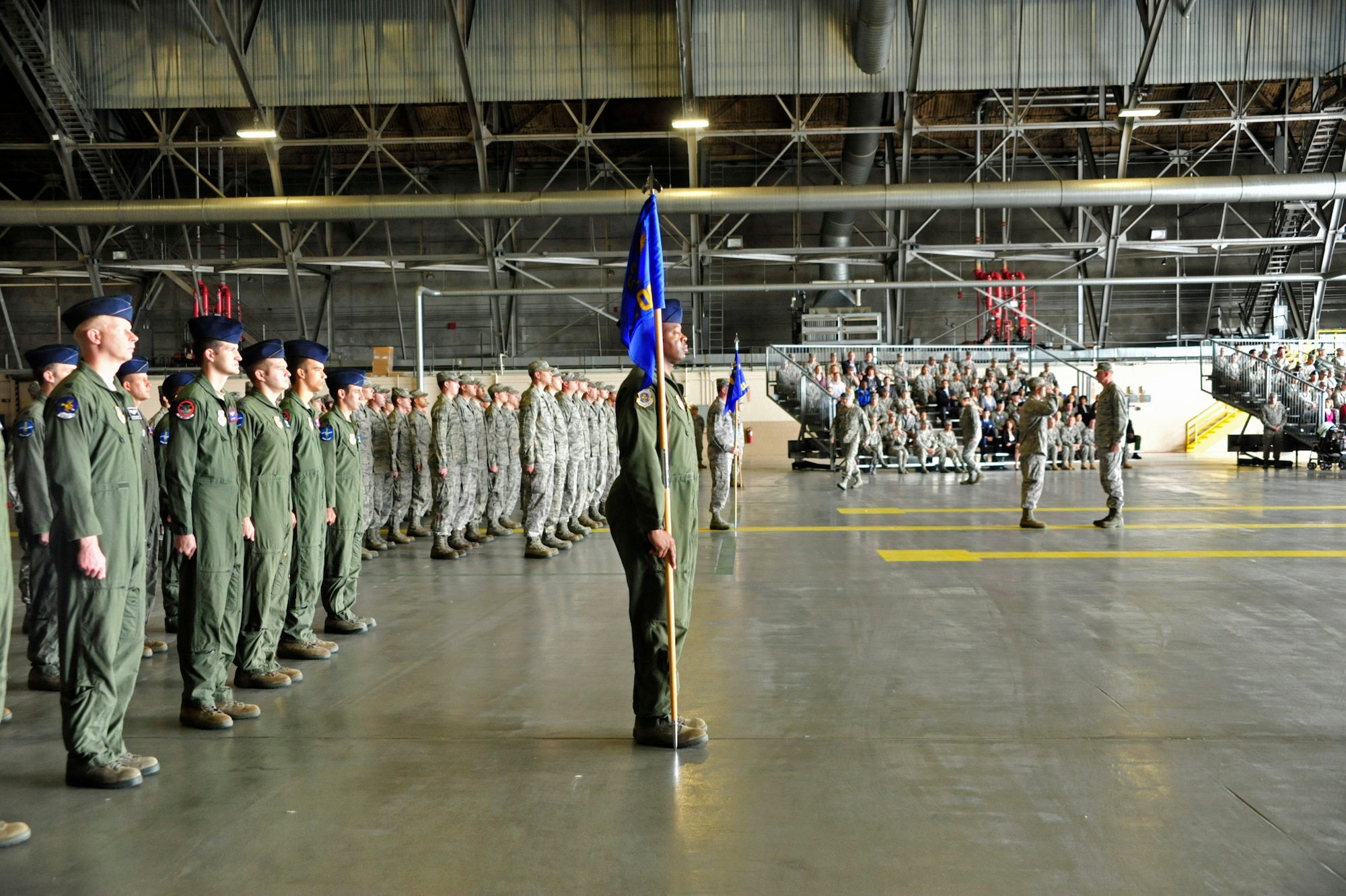 Members of the 62nd Airlift Wing stand at attention during the start of the 62nd AW Change of Command Ceremony June 14 at Joint Base Lewis-McChord, Wash. (U.S. Air Force photo/Staff Sgt. Frances Kriss)