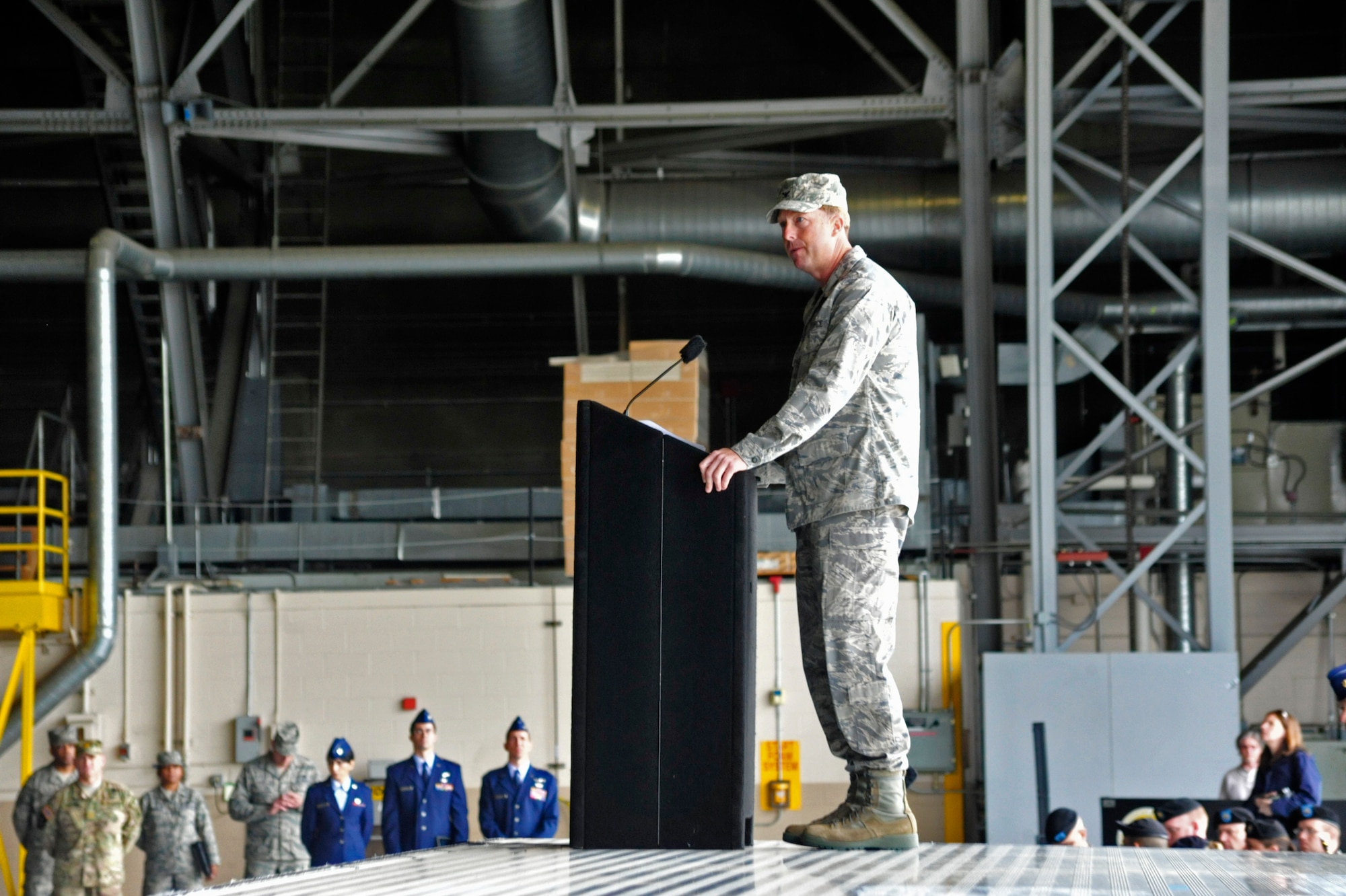 Col. R. Wyn Elder speaks for the first time as the new 62nd Airlift Wing commander during the 62nd AW Change of Command Ceremony June 14 at Joint Base Lewis-McChord, Wash. Colonel Elder took command from Col. Kevin Kilb. (U.S. Air Force photo/Staff Sgt. Frances Kriss)