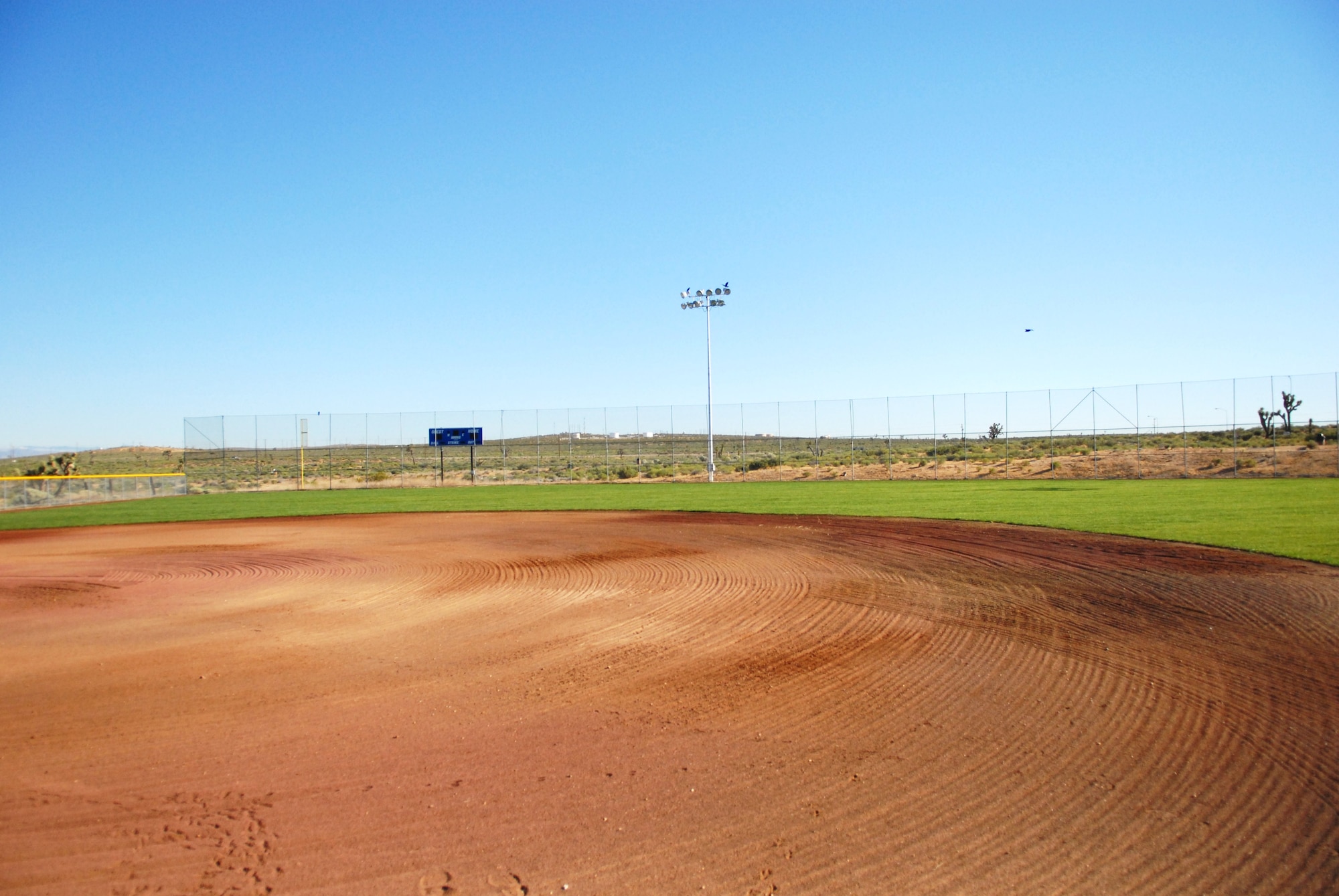 The softball field behind the Rosburg Fitness dons newly installed outfield grass and infield dirt. Nearly complete, the field construction is one of several Fitness and Sports Center projects. (Air Force photo by Kate Blais)