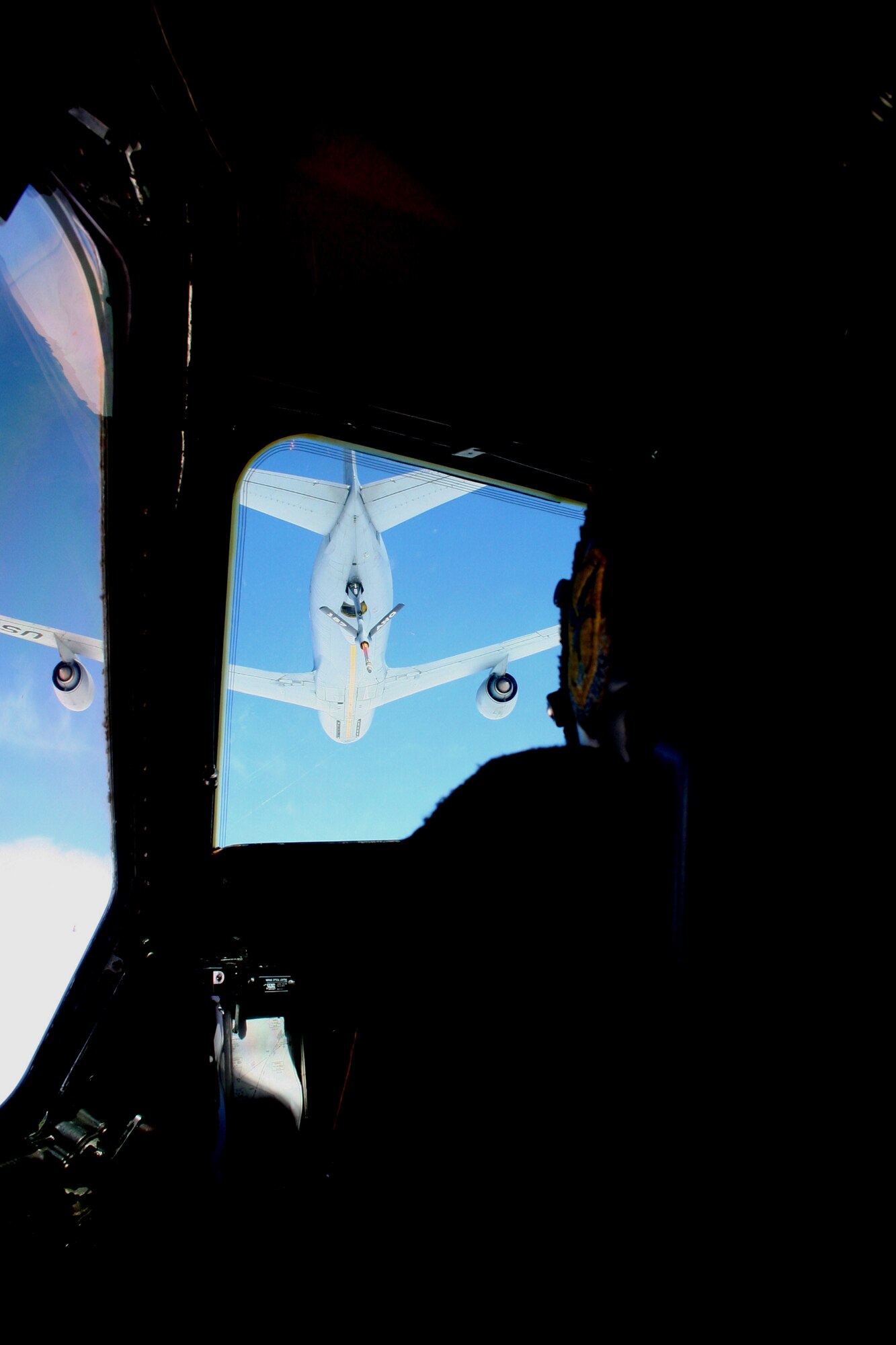 A KC-135R Stratotanker from the 157th Air Refueling Wing of the New Hampshire Air National Guard at Pease Air National Guard Base, N.H., prepares to refuel a C-5M Super Galaxy from Dover Air Force Base, Del., over northern Canada on June 5, 2011. The C-5M's mission was to complete the first Arctic overflight from Dover AFB to Bagram Airfield, Afghanistan. The plane successfully landed at Bagram just over 15 hours after take-off on June 6, 2011. (U.S. Air Force Photo/Master Sgt. Scott T. Sturkol)