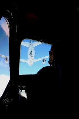 A KC-135R Stratotanker from the 157th Air Refueling Wing of the New Hampshire Air National Guard at Pease Air National Guard Base, N.H., prepares to refuel a C-5M Super Galaxy from Dover Air Force Base, Del., over northern Canada on June 5, 2011. The C-5M's mission was to complete the first Arctic overflight from Dover AFB to Bagram Airfield, Afghanistan. The plane successfully landed at Bagram just over 15 hours after take-off on June 6, 2011. (U.S. Air Force Photo/Master Sgt. Scott T. Sturkol)
