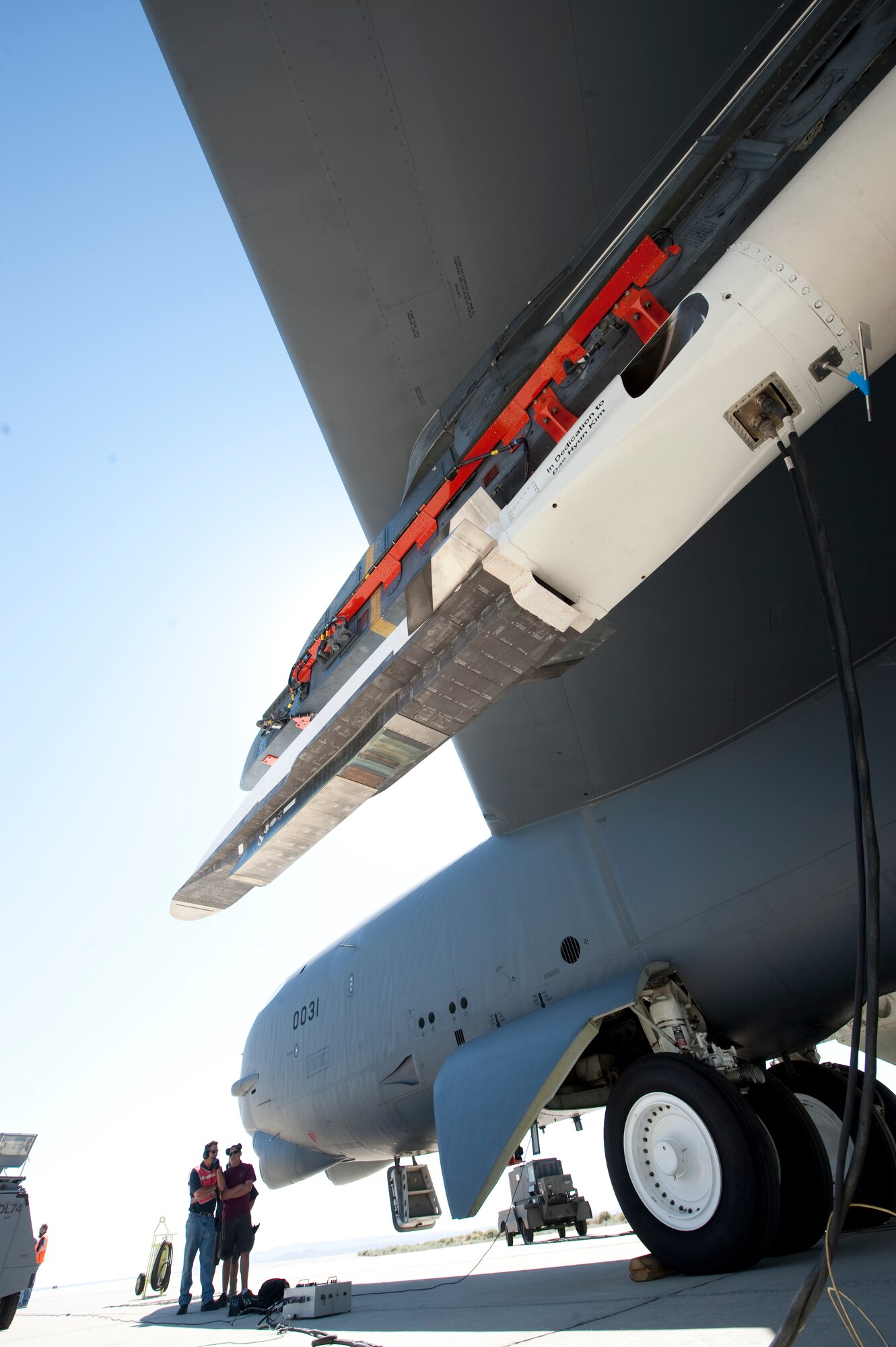Ground crew members observe the X-51A Waverider, which is affixed to an Edwards B-52H Stratofortress before being flow over the Pacific Ocean and launched June 13. (Photo by Bob Ferguson/Boeing)