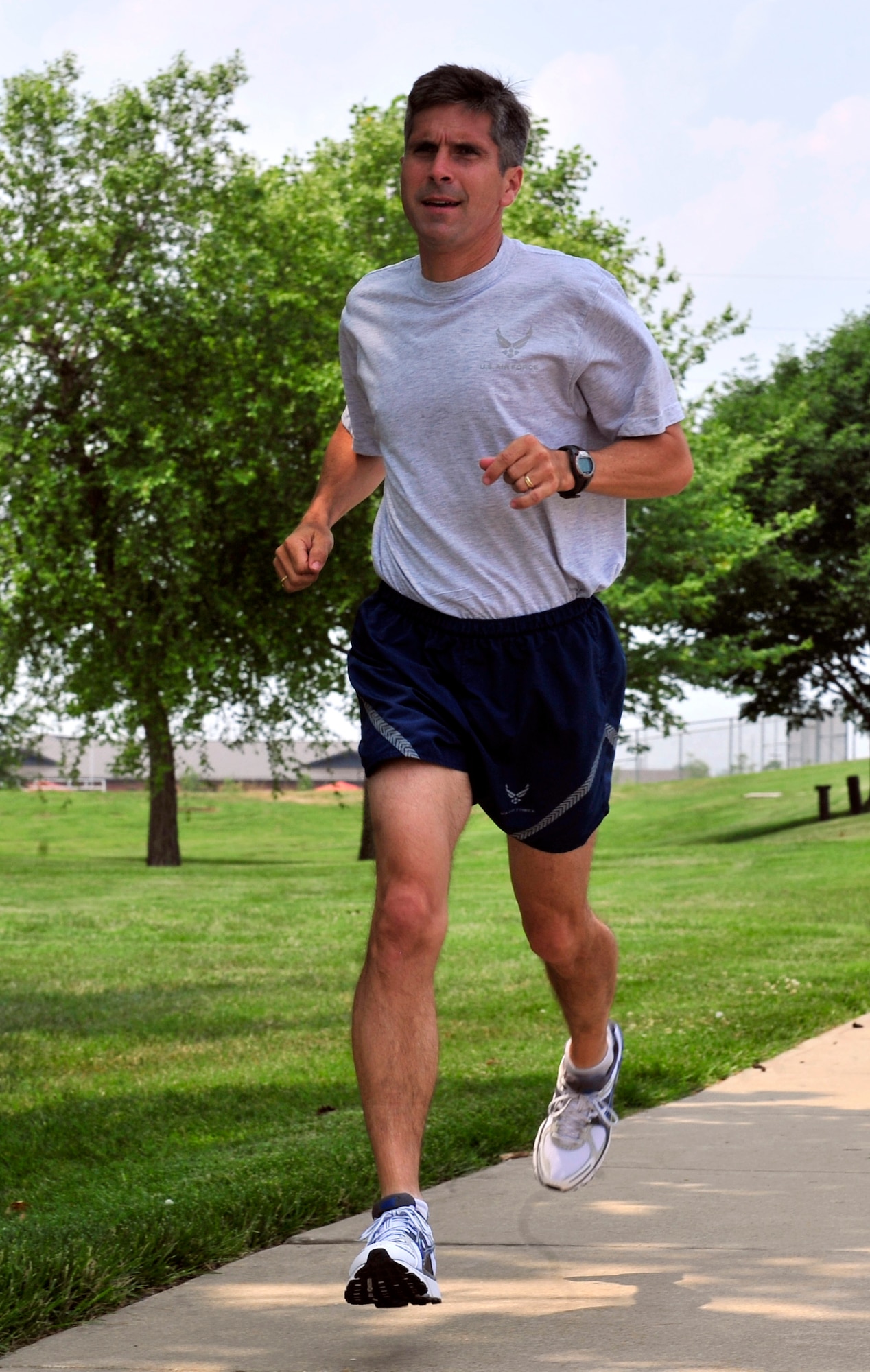 SCOTT AIR FORCE BASE, Ill. -- Lt. Col. Steven Jenkins, 618th Air and Space Operations Center (Tanker Airlift Control Center) Chief of the Homeland Defense Tanker Branch, runs on base June 9. Colonel Jenkins has scored 100 percent on his last four PT tests. (U.S. Air Force photo by Staff Sgt. Stephenie Wade)