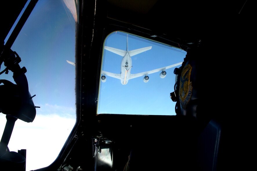 A KC-135R Stratotanker from the 157th Air Refueling Wing of the New Hampshire Air National Guard at Pease Air National Guard Base, N.H., prepares to refuel a C-5M Super Galaxy from Dover Air Force Base, Del., over northern Canada on June 5, 2011. The C-5M's mission was to complete the first Arctic overflight from Dover AFB to Bagram Airfield, Afghanistan. The plane successfully landed at Bagram just over 15 hours after take-off on June 6, 2011. (U.S. Air Force Photo/Master Sgt. Scott T. Sturkol)