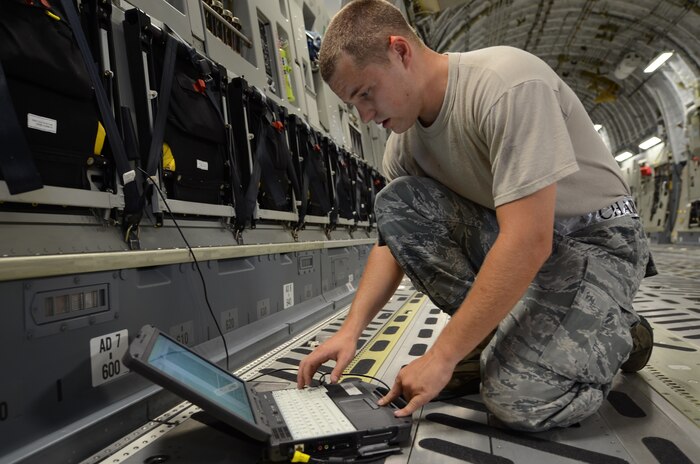 Senior Airman Richard Douglas references C-17 aircraft technical data on a computer  in preparation for Rodeo practice at Joint Base Charleston June 10. Airman Douglas is assigned to the 437th Aircraft Maintenance Squadron and is a member of the 437th Airlift Wing 2011 Air Mobility Command Rodeo team (U.S. Air Force photo/Tech. Sgt. Chrissy Best)

