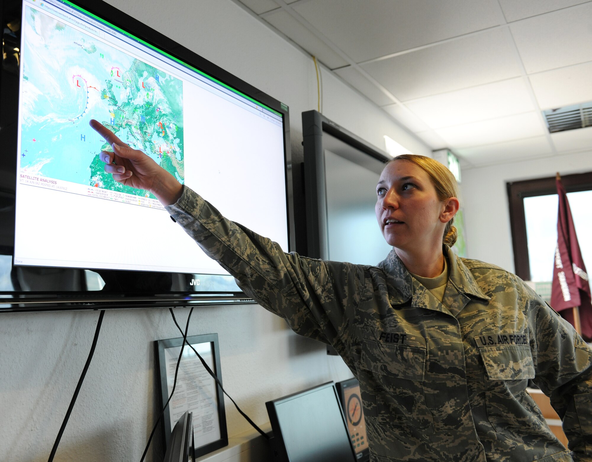 SPANGDAHLEM AIR BASE, Germany – Staff Sgt. Gayle Feist, 52nd Operations Support Squadron weather technician, points out possible weather fluctuations that may affect operations here June 14. The 52nd OSS Weather Flight prepares weather forecasts that are used by fighter squadrons and other base agencies. (U.S. Air Force photo/Senior Airman Nathanael Callon)