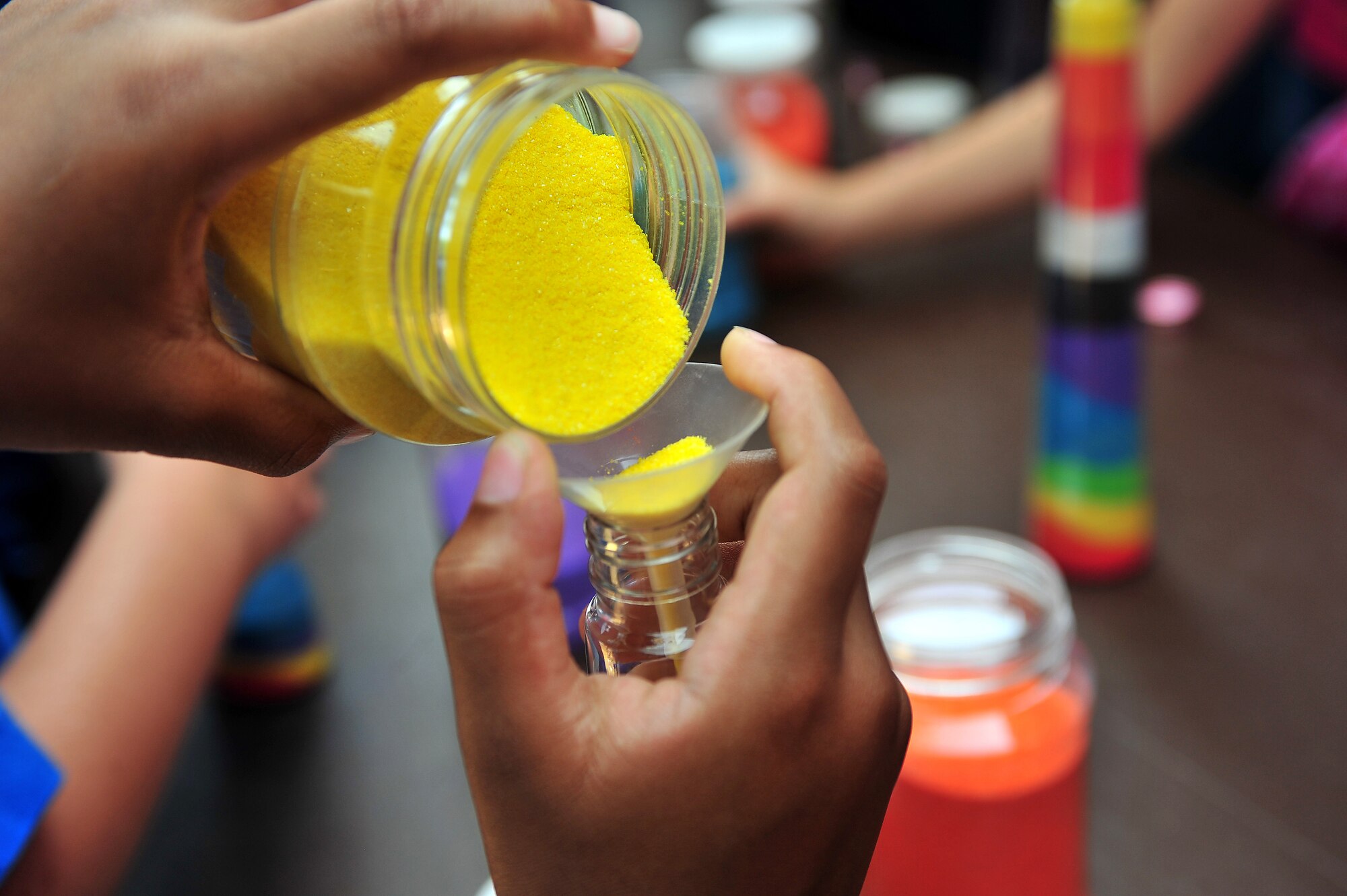 SHAW AIR FORCE BASE, S.C. -- Arts, such as color sand mixing, were a part of the 2011 the Department of Defense summer reading program kickoff at the McElveen Library here June 13, 2011. The theme for the program this year is , 'A Midsummer Knight's Read.' (U.S. Air Force photo/ Airman 1st Class Ashley Gardner (Released).