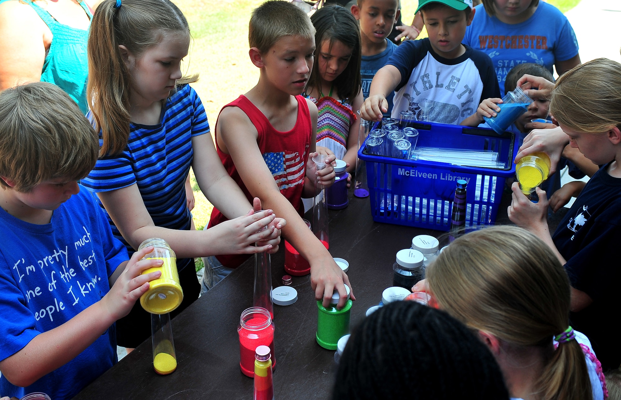SHAW AIR FORCE BASE, S.C. -- Children get creative at the color sand table during the Department of Defense summer reading program kickoff at the McElveen Library here, June 13,2011. The theme for the program this year is 'A Midsummer Knight's Read.' (U.S. Air Force photo/ Airman 1st Class Ashley Gardner (Released).