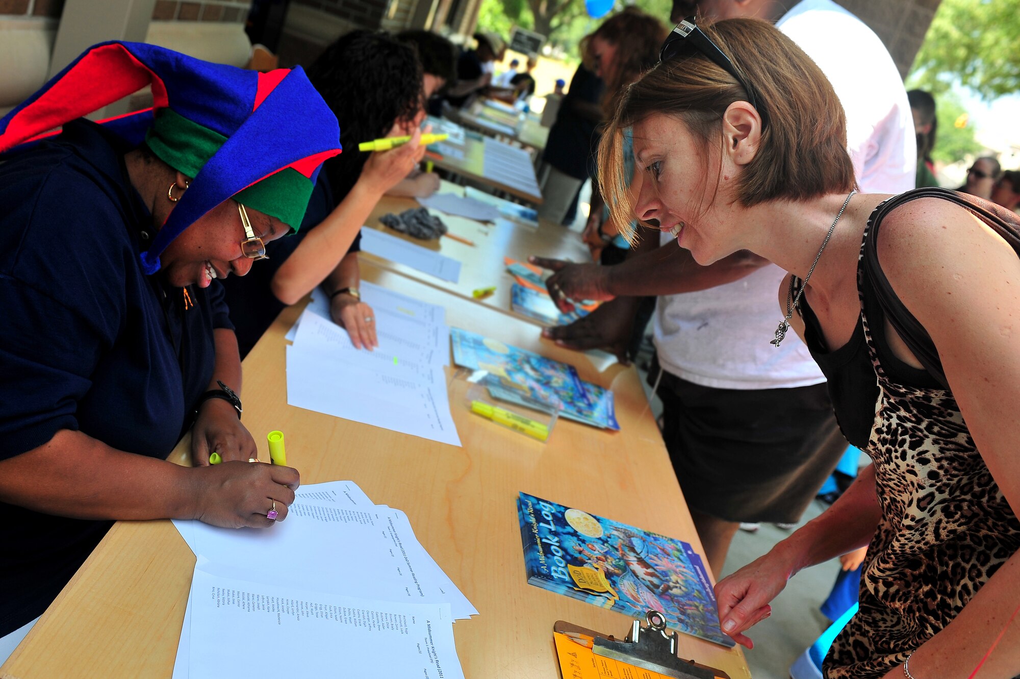 SHAW AIR FORCE BASE, S.C. -- Parents get in line to sign their children up for the Department of Defense summer reading program kickoff at the McElveen Library here, June 13, 2011. The theme for the program this year is 'A Midsummer Knight's Read.' (U.S. Air Force photo/ Airman 1st Class Ashley Gardner (Released).