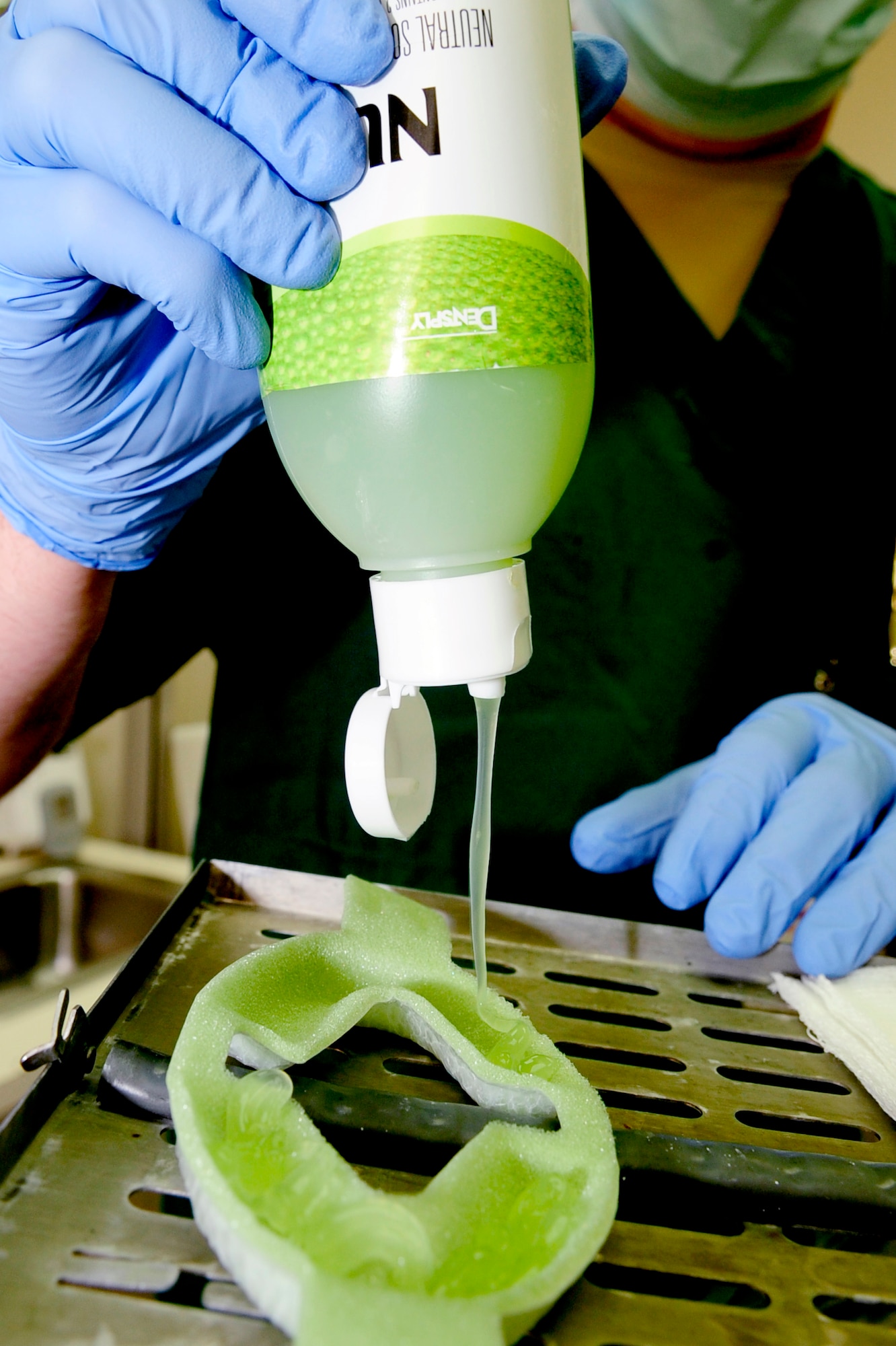 RAF MILDENHALL, England -- A fluoride gel is applied to a tray in preparation for a patient's routine cleaning here June 14, 2011.  Fluoride is applied to each patient's teeth after their cleaning to help strengthen the teeth and make them more resistant to acid erosion. (U.S. Air Force photo/Senior Airman Ethan Morgan)