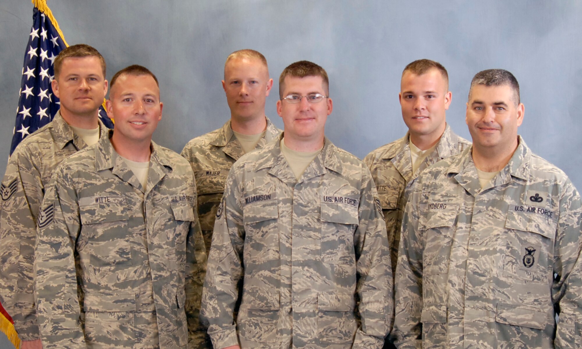 Members of the South Dakota Air National Guard Combat Pistol and Rifle Team are; back row, left to right, Staff Sgt. Joshua Nelson, Tech. Sgt. Jeremy Wajer, Staff Sgt. Adam Witte. Front row, left to right, Tech. Sgt. Michael Witte, Staff Sgt. Jason Williamson, and Master Sgt. Chad Rydberg.(Photo by Master Sgt. Nancy Ausland)(RELEASED)
