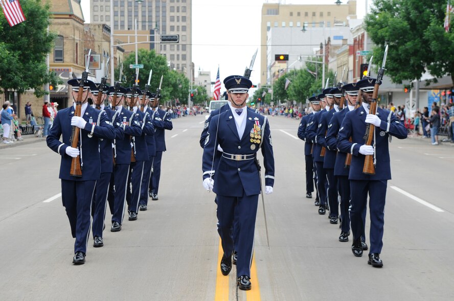 Members of the U.S. Air Force Drill Team march down College Avenue June 11 amid applause from approximately 50,000 spectators during Appleton, Wisconsin’s 61st Flag Day Parade. The Appleton Flag Day Parade Committee selects a different branch every year to represent the U.S. military during their annual Flag Day Parade. This year the U.S. Air Force was chosen. (U.S. Air Force photo by Staff Sgt. 