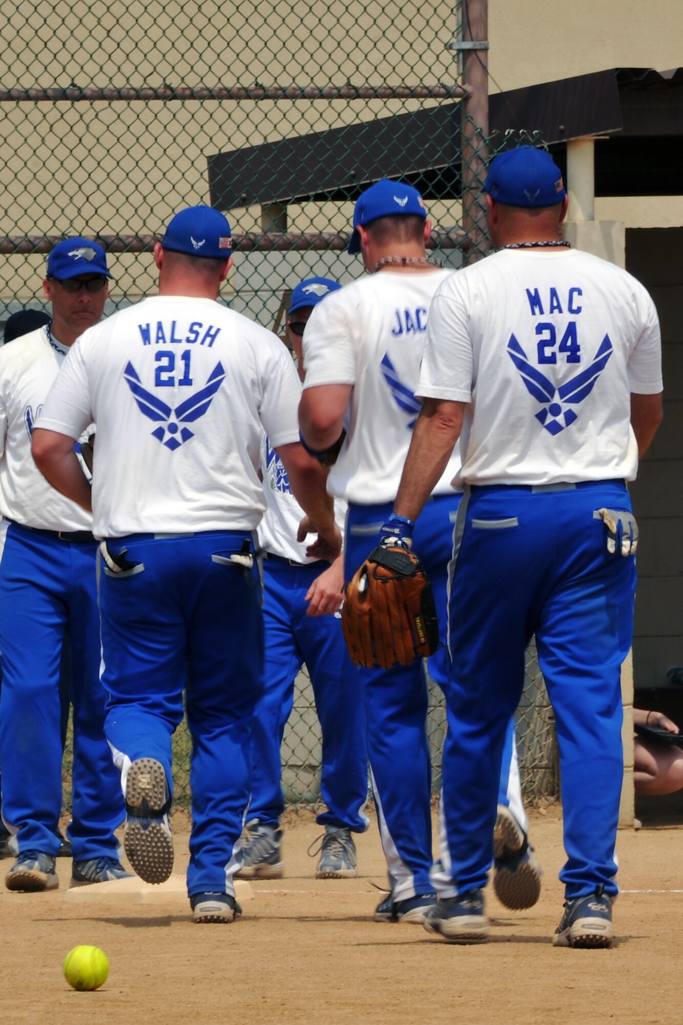 KUNSAN AIR BASE, Republic of Korea -- Members of the Kunsan softball team walks toward the batting cage after an inning here June 12. Kunsan’s softball team played three games against the U.S. Army Garrison’s softball team, Kunsan winning a series of 3-1. (U.S. Air Force photo/Senior Airman Brittany Y. Bateman)