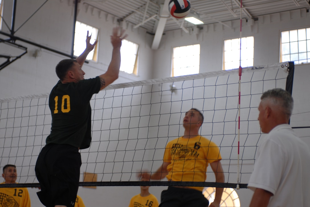 Finance and Medical battled neck and neck at the Marine Corps Recruit Depot San Diego field house June 15. Finance won the first match easily. Medical regrouped and won the second game, forcing another game to break the tie. Finance won the third match, giving them a 2-1 victory in the best two-out-of-three format.
