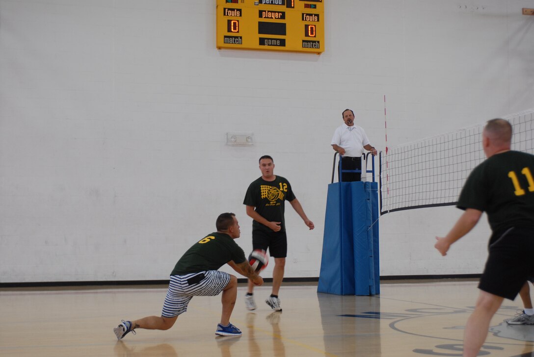 Finance and Medical battled neck and neck at the Marine Corps Recruit Depot San Diego field house June 15. Finance won the first match easily. Medical regrouped and won the second game, forcing another game to break the tie. Finance won the third match, giving them a 2-1 victory in the best two-out-of-three format.
