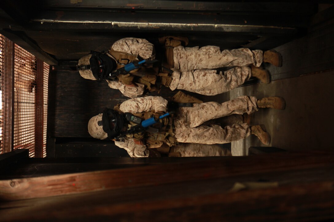 Marines with the 11th Marine Expeditionary Unit's maritime raid force (MRF), clear rooms with simulated hostile targets during an MRF training course here June 15. The  training is part of a large-scale MEU field exercise, it's first since coming together in May.