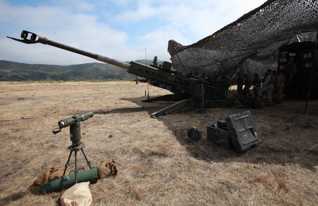 An M777A2 howitzer, with Kilo Battery, Battalion Landing Team 3/1, is concealed under camouflage netting during a field exercise with the 11th Marine Expeditionary Unit here June 15. The purpose of the exercise is to prepare the unit for its upcoming deployment.