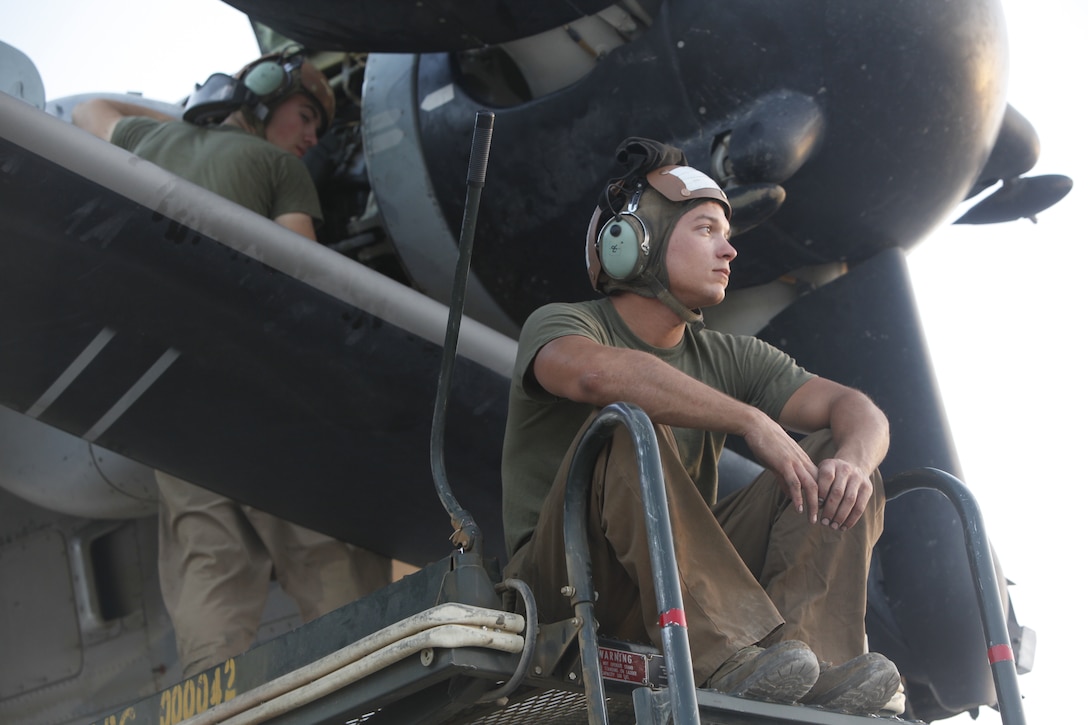 Sgt Jacob Carson takes a break from maintaining an MV-22B Osprey at Camp Bastion, Afghanistan, June 16. Carson is a flightline mechanic with VMM-264 based out of Marine Corps Air Station New River, N.C. In 2007, the Osprey began replacing the CH-46 Sea Knight, which had been in service since 1962, with providing assault support and transport for the Marine Corps.