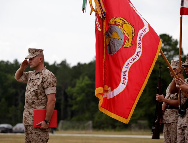 Lt. Col. Chris S. Richie salutes during the playing of the national anthem at the Marine Air Control Squadron 2 change of command ceremony at the squadron's parade field June 16. Richie relinquished command to Lt. Col. Darry W. Grossnickle.