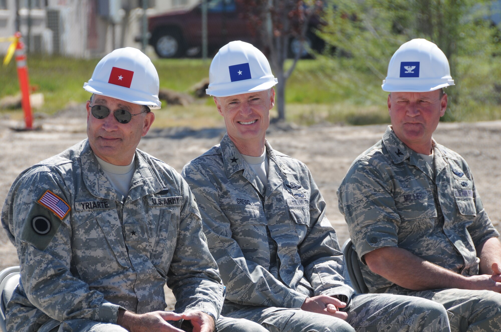Brig. Gen. Charles L. Yriarte, Oregon Army National Guard Land Component Commander, Brig. Gen. Steven D. Gregg, Oregon Air National Guard Commander, and Col. James Miller, 173rd Fighter Wing Commander, listen to Oregon Senator Ron Wyden speak during the ground breaking ceremony for the Joint Armed Forces Reserve Center June 9, 2011 at Kingsley Field, Klamath Falls, Ore.  When completed the building will house the 173rd Security Forces Squadron and Charlie Troop, 1-82nd Cavalry, Oregon Army National Guard.  (U.S. Air Force Photo by Tech. Sgt Jennifer Shirar) RELEASED