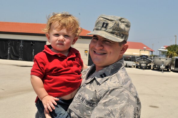 PATRICK AIR FORCE BASE, Fla. - Air Force Reservist Capt. Ryan Liss, public affairs officer, 920th Rescue Wing here, introduces his toddler son, Ben, around the unit during the June unit training assembly. (U.S. Air Force photo/Capt. Cathleen Snow)
