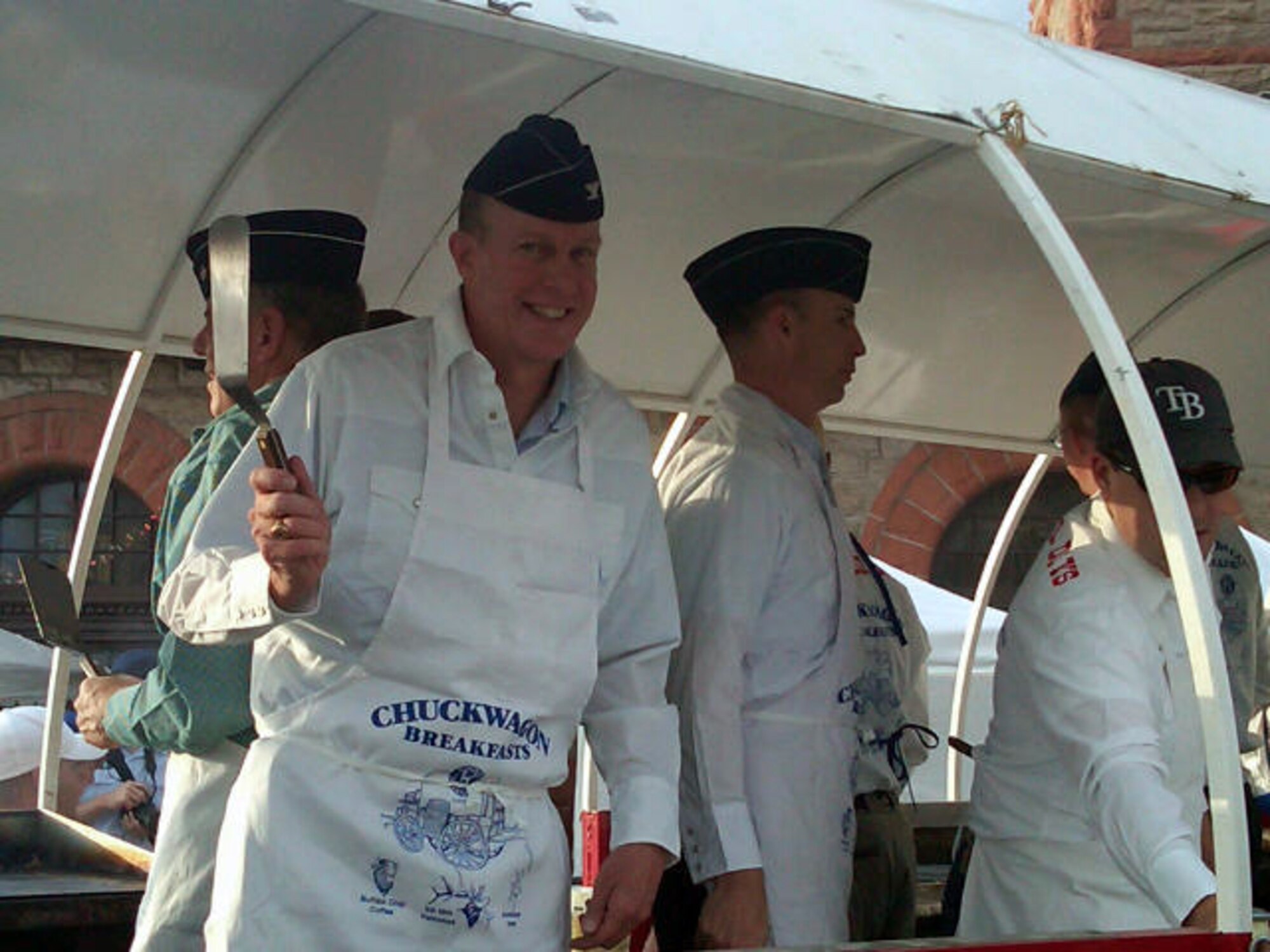 Col. John Boyle, 90th Mission Support Group commander, helps serve pancakes in downtown Cheyenne, Wyo., during Cheyenne's Frontier Days in 2010. (Courtesy photo)