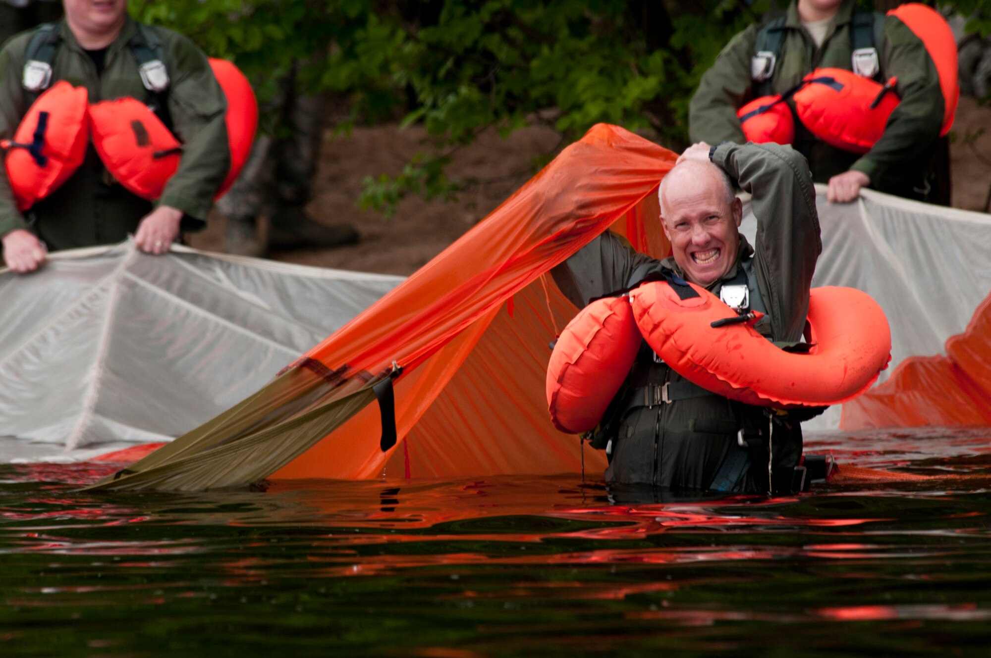 Lt. Col. Daniel Gabrielli emerges from under a parachute canopy June 11, 2011, during aircrew survival training in the St. Croix River near Hastings, Minn. Colonel Gabrielli is assigned to the Minnesota Air National Guard's 133rd Airlift Wing. (U.S. Air Force photo/Tech. Sgt. Erik Gudmundson) 

