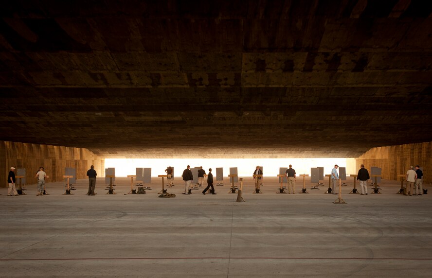 U.S. Air Force Office of Special Investigations Detachment 211 members set up shooting targets during their quarterly combat arms training and maintenance at Moody Air Force Base, Ga., June 16, 2011. In addition to quarterly combat arms training, AFOSI members are required to annually qualify in weapons handling. (U.S. Air Force photo by Airman 1st Class Joshua Green/Released)
