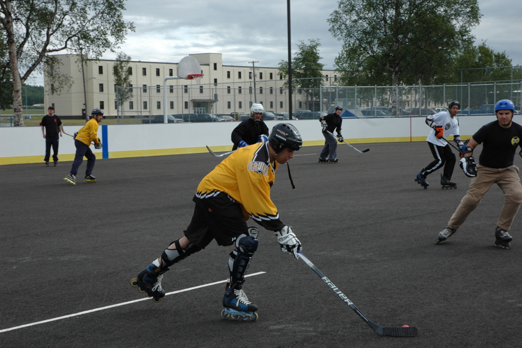 Members of the 381st Intelligence Squadron square off against the team fielded by the 673d Aerospace Medical Squadron during the in-line hockey tournament of the Arctic Warrior Olympics. (U.S. Air Force photo\1st Lt. Matthew Chism)
