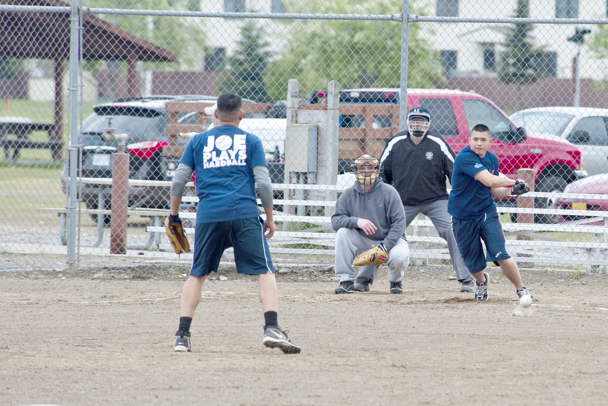 JOINT BASE ELMENDORF-RICHARDSON, Alaska ? Robert Camacho, of the 673d Force Support Squadron, hits a ball pitched by Curtis Lopez, of the 3rd Maintenance Squadron, to the left side of the field during an intramural softball game June 7. The 3rd MXS topped the 673d FSS with a score of 14 to 3 starting themselves out with a 2-0 record and leaving the FSS 0-2. (Air Force photo/Senior Airman Christopher Gross)