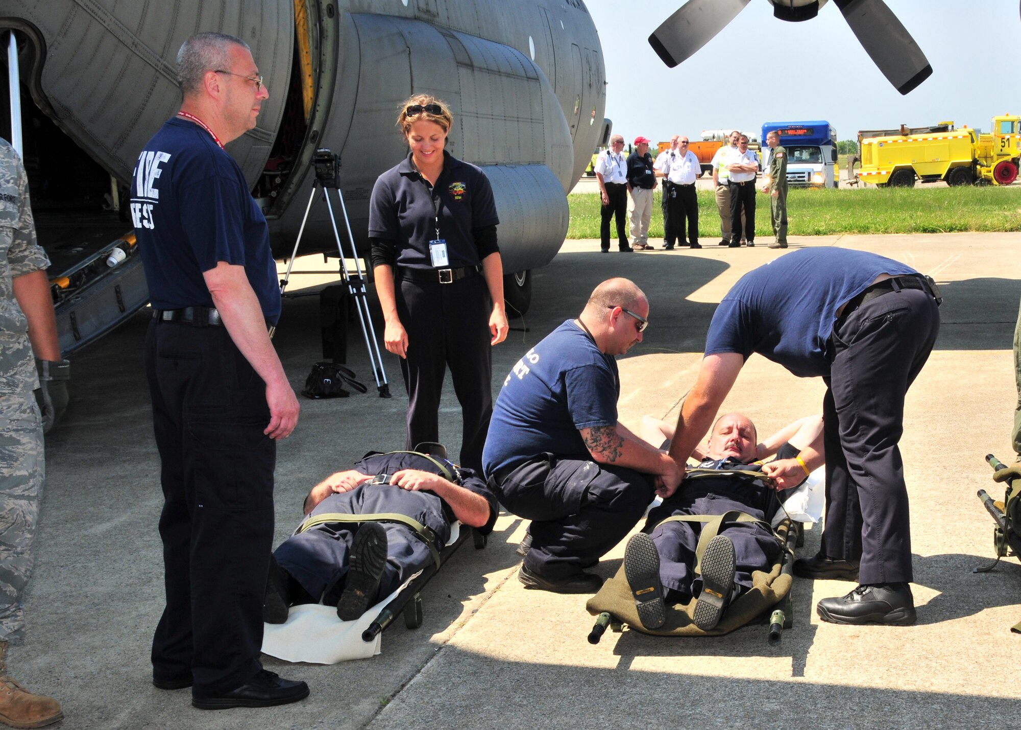Members of the 914th Airlift Wing, along with the VA, Erie County Emergency Management Services, local fire departments and EMS engage in Operation Archangel June 15, 2011, Buffalo, NY. The exercise was a simulation of a massive earthquake that included simulated injured brought to WNY for medical treatment. (U.S. Air Force photo by Staff Sgt. Joseph McKee)