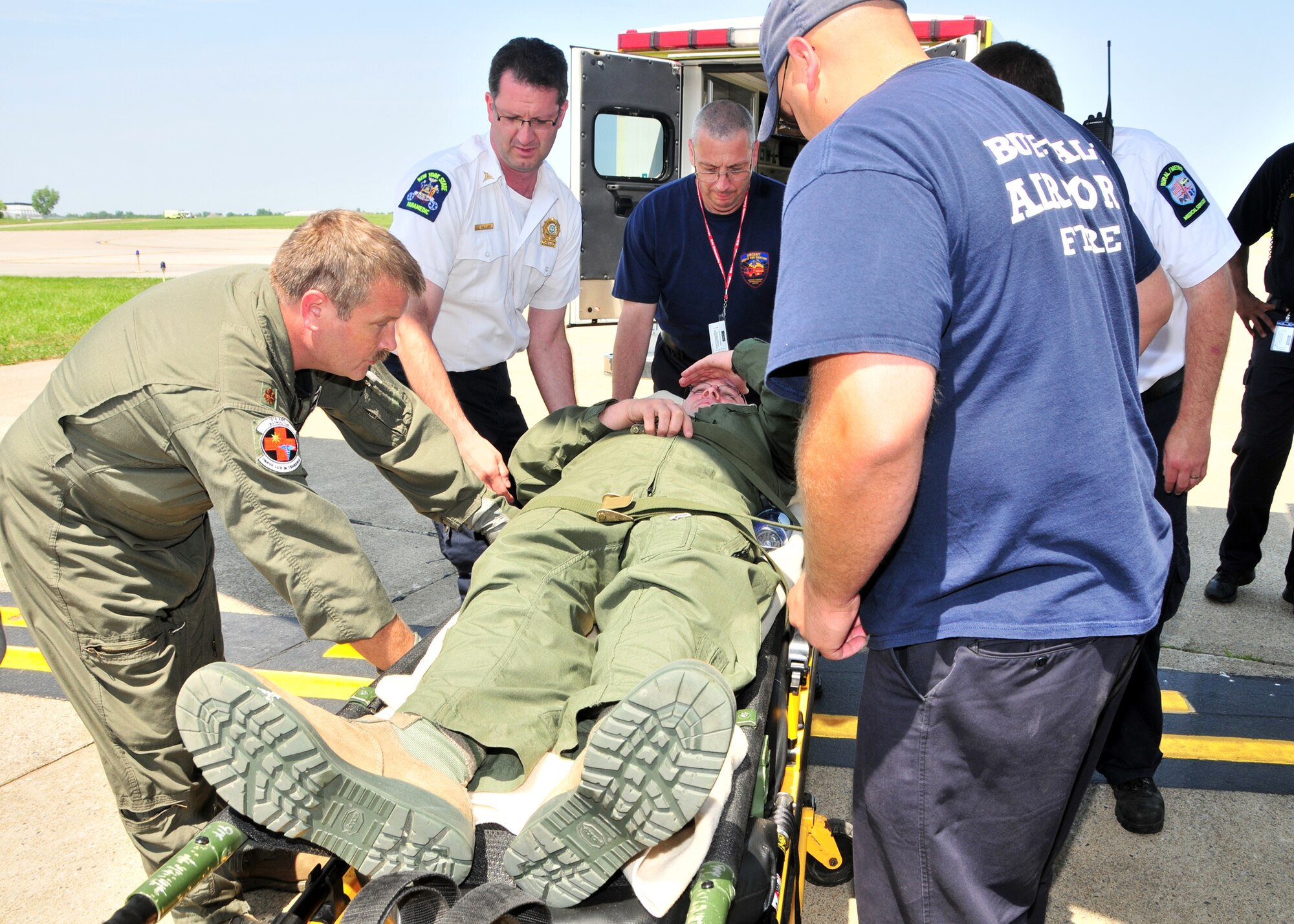 Members of the 914th Airlift Wing, along with the VA, Erie County Emergency Management Services, local fire departments and EMS engage in Operation Archangel June 15, 2011, Buffalo, NY. The exercise was a simulation of a massive earthquake that included simulated injured brought to WNY for medical treatment. (U.S. Air Force photo by Staff Sgt. Joseph McKee)