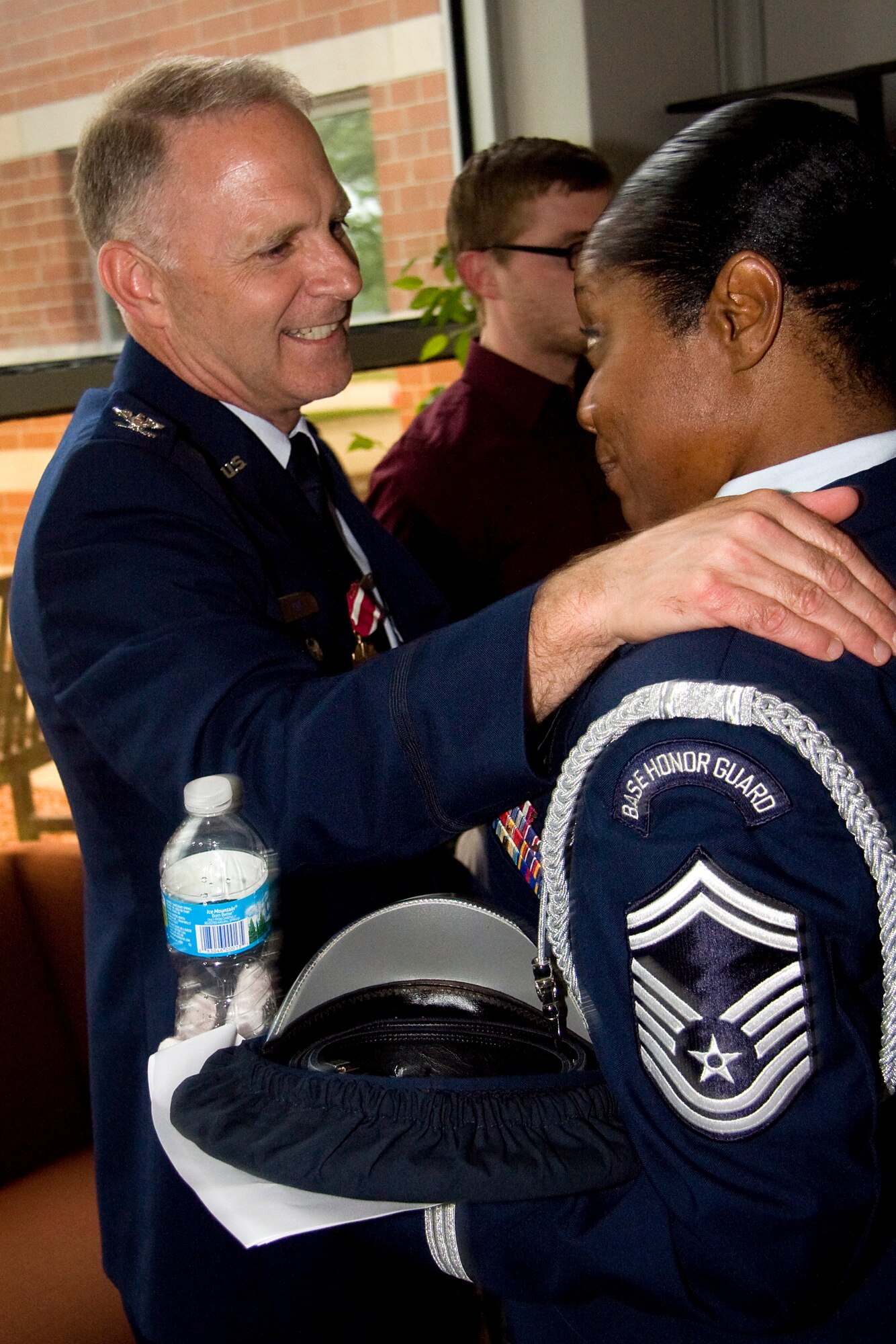 GRISSOM AIR RESERVE BASE, Ind. -- Senior Master Sgt. Linda Mason-Wilson, 434th Aerospace Medicine Squadron, congratulates Col. Tim Cox, 434th Air Refueling Wing vice commander, in a reception line after the colonel's retirement ceremony May 14. Sergeant Mason-Wilson was the 74th Air Refueling Squadron first sergeant when Colonel Cox was the unit?s commander. The colonel retired from the Air Force Reserve after 30 years of military service and thanked Sergeant Mason-Wilson for her help and guidance when he first became a squadron commander. (U.S. Air Force photo/Tech. Sgt. Mark R. W. Orders-Woempner) 
