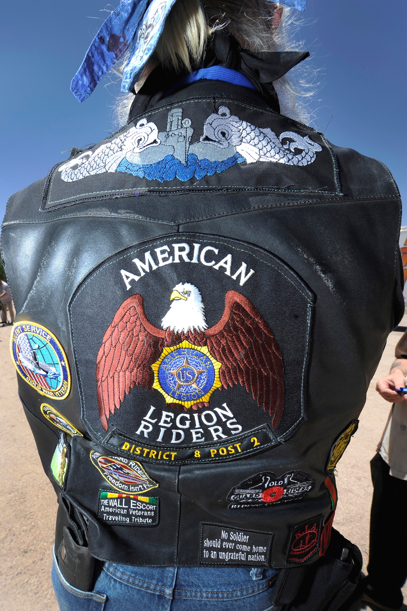 Patriot Guard Rider, "Santa Eddie," displays his "colors" before departing from Colorado Springs, Colo., June 7, 2011, for an escort ride to Fort Carson, Colo. Approximately 35 riders, many with the Patriot Guard Riders, escorted the raveling Vietnam Memorial Wall. (U.S. Air Force photo/ Dennis Rogers