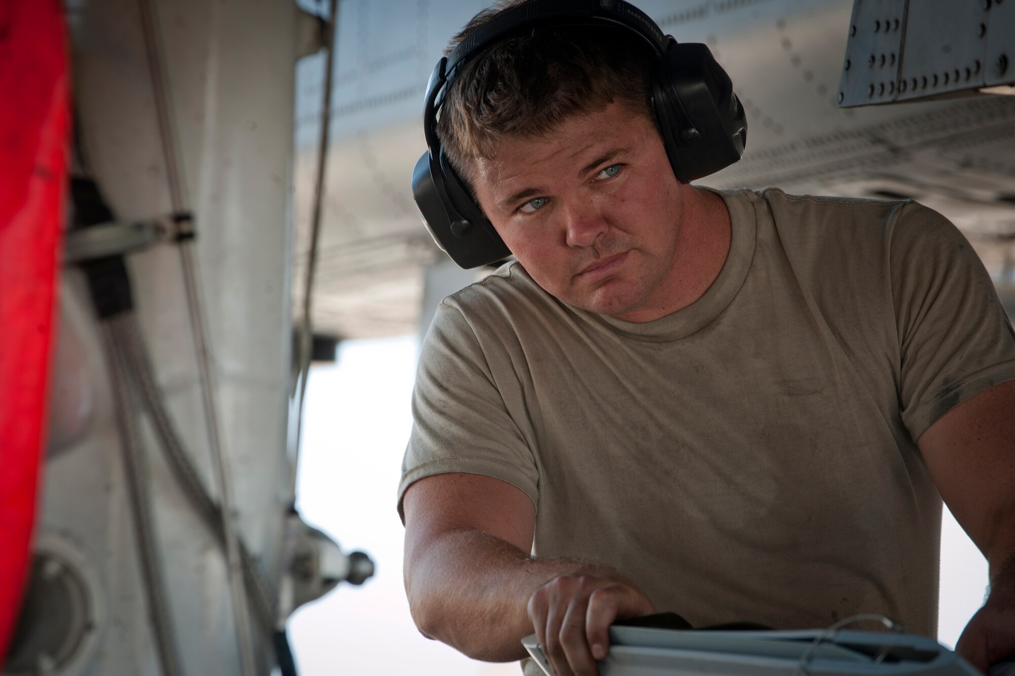 U.S. Air Force Staff Sgt. Jason Greene, 74th Aircraft Maintenance Unit load team chief, guides an unloaded bomb from beneath an A-10C Thunderbolt II during a phase II operational readiness exercise flying surge at Moody Air Force Base, Ga., June 15. During the exercise, load crews and maintenance personnel conducted operations as if they were at a deployed location. (U.S. Air Force photo by Senior Airman Benjamin Wiseman/Released)