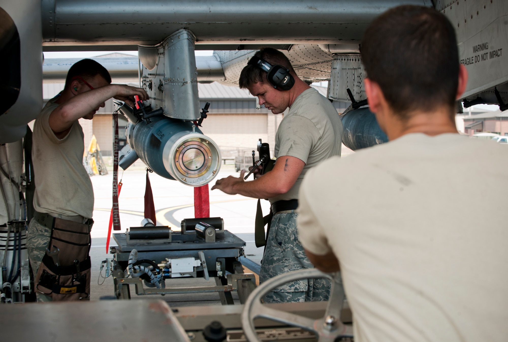 A weapons load crew from the 23rd Aircraft Maintenance Squadron unloads a GBU-12 (guided bomb unit) from an A-10C Thunderbolt II during a phase II operational readiness exercise flying surge at Moody Air Force Base, Ga., June 15. The exercise was conducted to better prepare the maintainers for future inspections. (U.S. Air Force photo by Senior Airman Benjamin Wiseman/Released)
