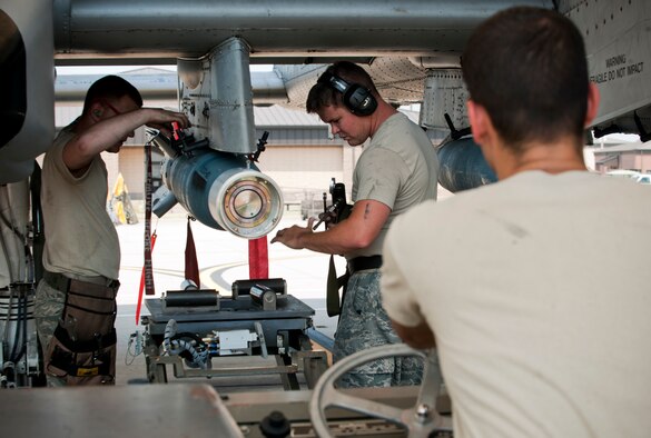 A weapons load crew from the 23rd Aircraft Maintenance Squadron unloads a GBU-12 (guided bomb unit) from an A-10C Thunderbolt II during a phase II operational readiness exercise flying surge at Moody Air Force Base, Ga., June 15. The exercise was conducted to better prepare the maintainers for future inspections. (U.S. Air Force photo by Senior Airman Benjamin Wiseman/Released)