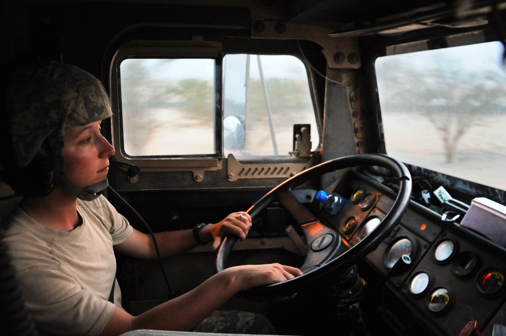 Senior Airman Kelly McLain, a vehicle operator with the 387th Expeditionary Logistics Readiness Squadron, keeps her eyes on the road while driving to her next location during a local convoy mission. What would take a normal hour and a half to drive can mean three to four hours on the road for a combat trucker. (U.S. Air Force photo by Senior Airman Cynthia Spalding)