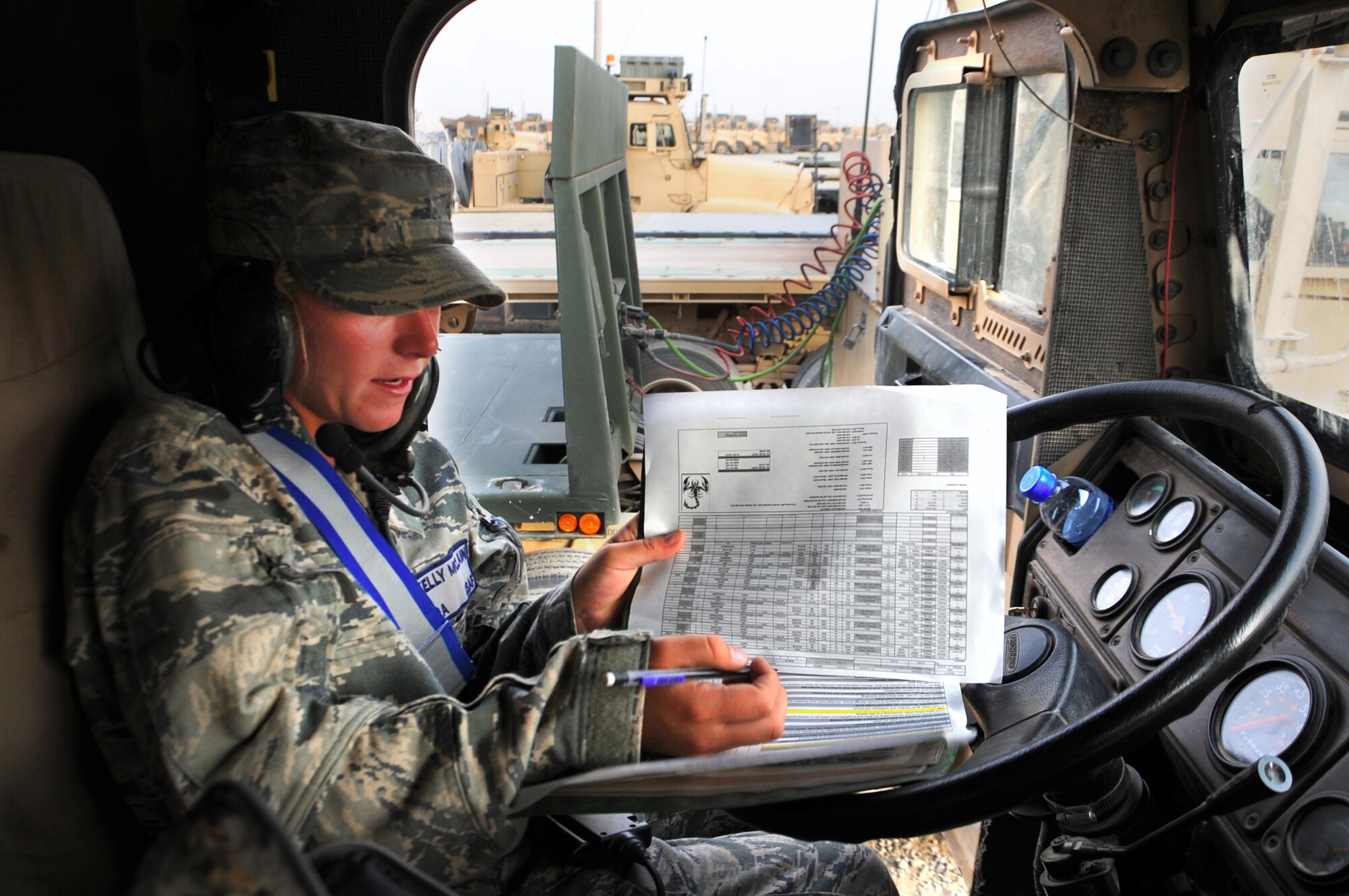 Senior Airman Kelly McLain signs off on the vehicle checklist prior to heading out on the road for a local mission. Teams of 13 Airmen rotate weeks for completing local missions with other Army teams. Airman McLain is a vehicle operator with the 387th Expeditionary Logistics Readiness Squadron. (U.S. Air Force photo by Senior Airman Cynthia Spalding)