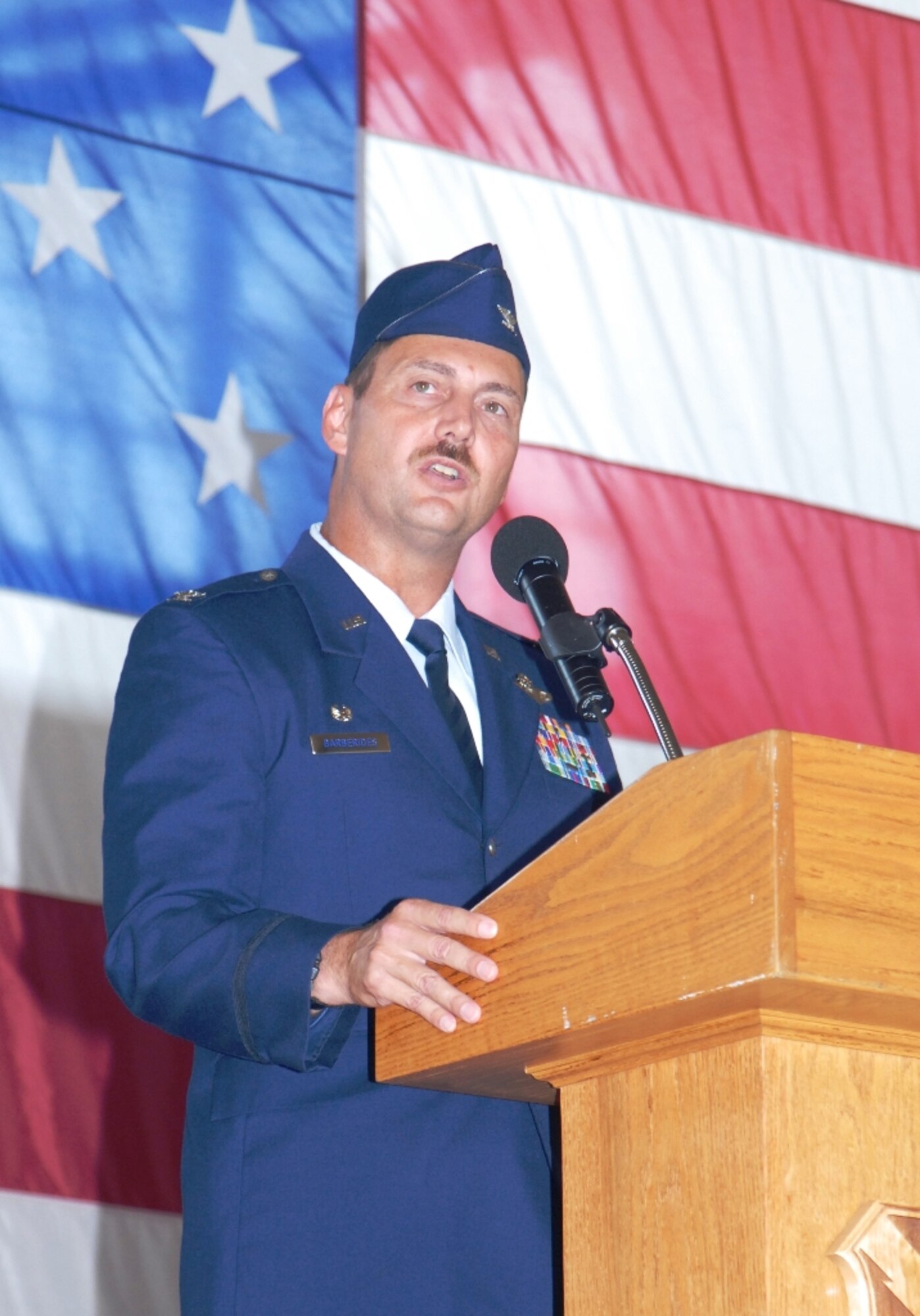 U.S. Air Force Col. Scott Barberides speaks to 101st Air & Space Operations Group (101st AOG) for the last time as the 101st AOG commander during a change of command ceremony held here June 11, 2011.  This was the very first change of command ceremony for the 101st AOG, which was officially activated July 1, 2009. Colonel Barberides served as the first commander of the 101st AOG. (U.S. Air Force photo by Maj. Steve Burke/Released)