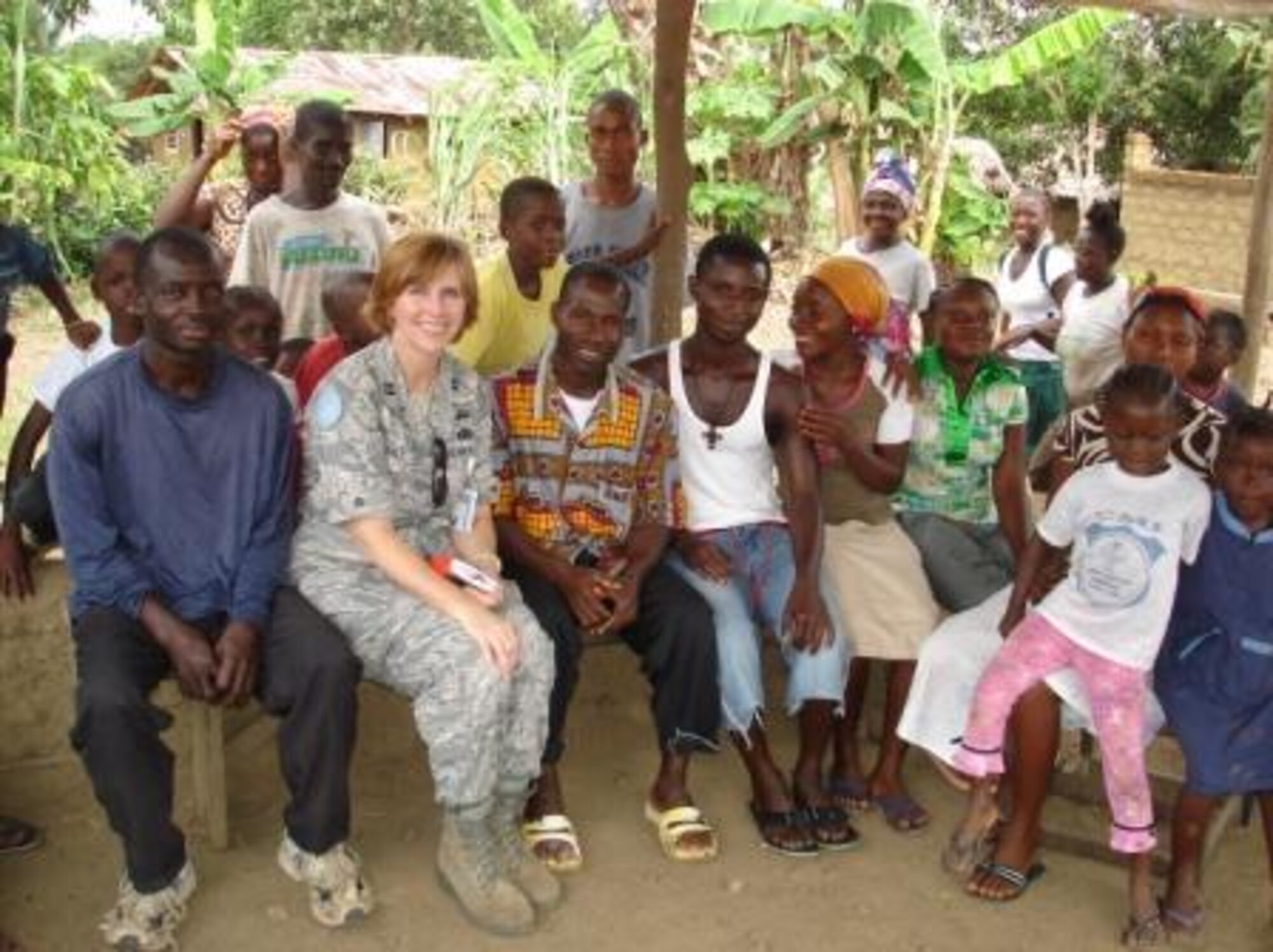 Capt. Lisa Gerlt visits with residents of a local village in St. Paul River outside the capital city of Monrovia, Liberia. Gerlt is deployed from Headquarters Air Combat Command Directorate of Requirements to serve as a Military Observer for the United Nations Mission in Liberia. (Courtesy photo)