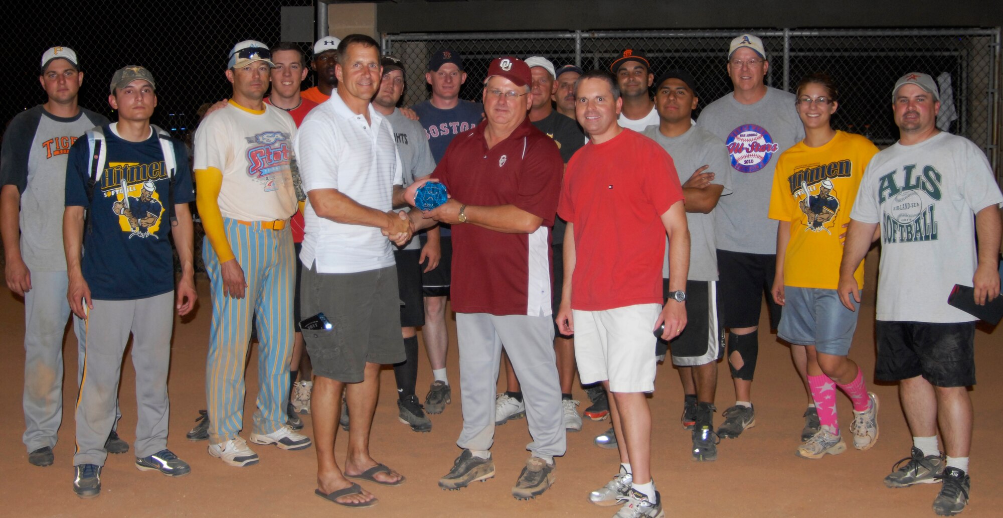 GOODFELLOW AIR FORCE BASE, Texas -- Col. Paul Bugenske, 17th MIssion Support Group Commander, presents the 17th Training Support Squadron Tigers with their second place softball trophy June 15. The Tigers played three back-to-back games against the 17th Security Forces Squadron's 1st Responders during the 2011 Base Intramural Softball  Championship.  (U.S. Air Force photo/Connie Hempel)