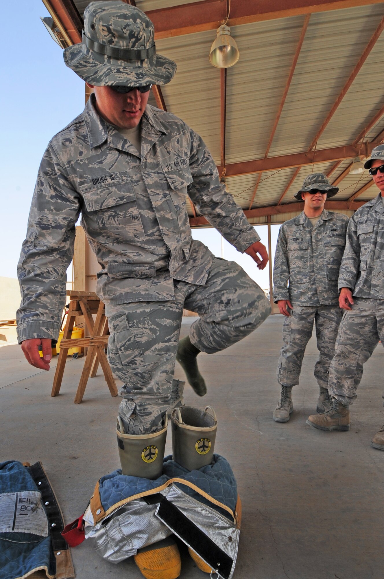 Deployed cadets from the U.S. Air Force Academy participate in a training routine challenge with 386th Expeditionary Civil Engineering Squadron firefighters. Operation Air Force Deployed is a month-long joint USAFA/ROTC immersion-based program to give cadets first-hand knowledge of daily life as a deployed officer. It exposes them to a variety of Air Force Specialty Codes as well as working relationships between operations and support squadrons and between officers and enlisted Airmen. (U.S. Air Force photo by Senior Airman Cynthia Spalding)