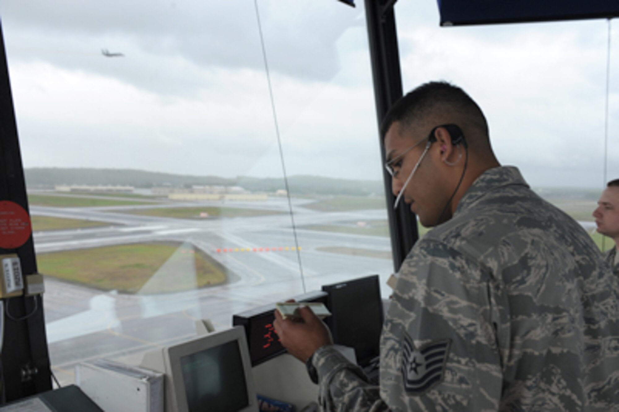 Tech. Sgt. Jorge Riviera issues flight clearances for fighter aircraft preparing to launch in support of Exercise Northern Edge 11 June 14, 2011, at Joint Base Elmendorf-Richardson, Alaska. Northern Edge is the largest military training exercise in Alaska and is designed to prepare joint forces to respond to crises throughout the Asia-Pacific region. (U.S. Photo by Petty Officer 2nd Class Rufus Hucks) 