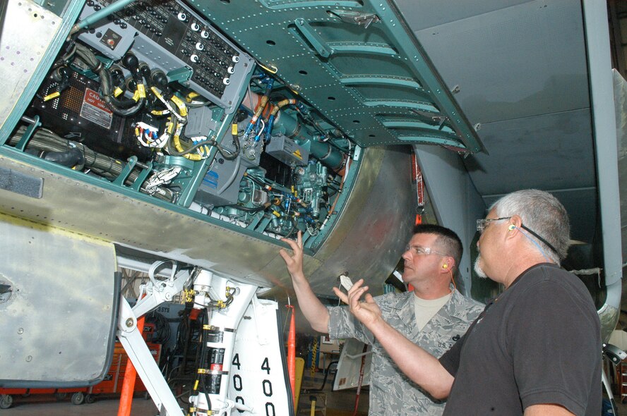 Master Sgt. Thomas Ball, 142nd Fighter Wing, gets an up-close look as Mark Krautkremer, F-15 customer relations and quality assurance, gives a tour. U. S. Air Force photo by Sue Sapp