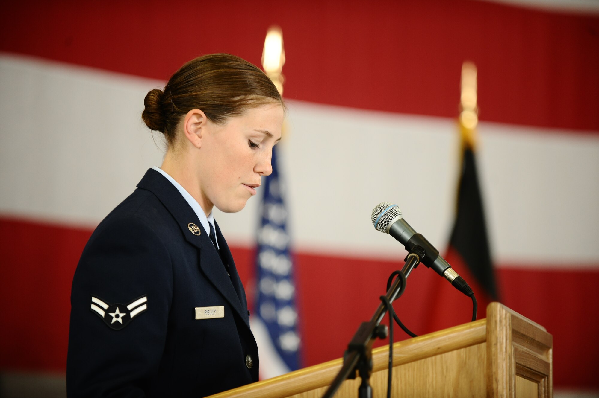SPANGDAHLEM AIR BASE, Germany – Airman 1st Class Jacqueline Risley, 52nd Civil Engineer Squadron Explosive Ordnance Disposal Flight, recites the Explosive Ordnance Disposal Prayer during the memorial service for Staff Sgt. Joseph J. Hamski, 52nd CES EOD Flight, held here June 16. Sergeant Hamski was killed in action May 26, 2011, in Shorabak, Afghanistan, while responding to a known enemy weapons cache. (U.S. Air Force photo/Senior Airman Nathanael Callon)