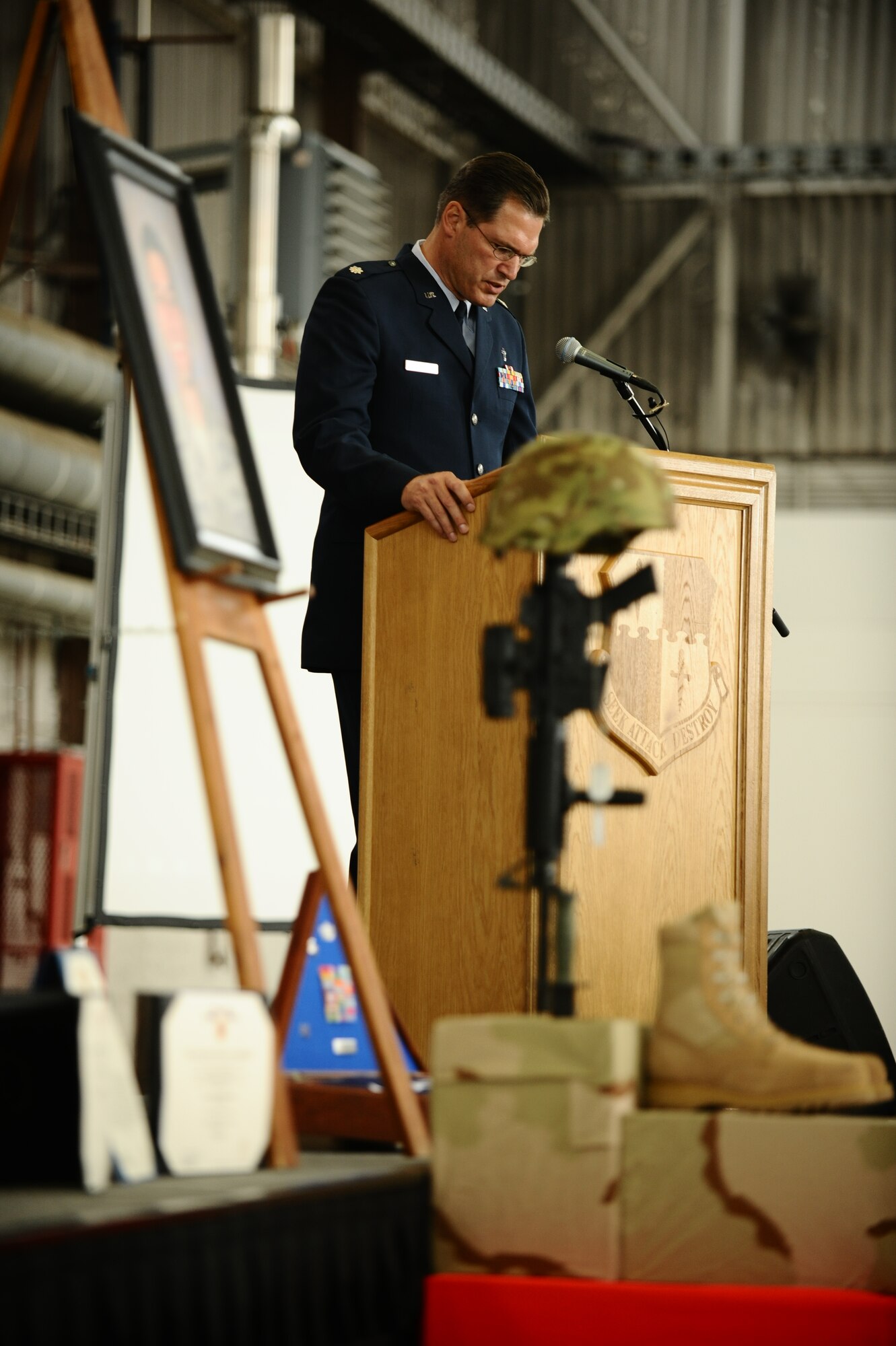 SPANGDAHLEM AIR BASE, Germany – Chaplain Lt. Col. David Carr, 52nd Fighter Wing chaplain, prays during the invocation of the memorial service for Staff Sgt. Joseph J. Hamski, 52nd Civil Engineer Squadron Explosive Ordnance Disposal Flight, held here June 16. Sergeant Hamski was killed in action May 26, 2011, in Shorabak, Afghanistan, while responding to a known enemy weapons cache. (U.S. Air Force photo/Senior Airman Nathanael Callon)