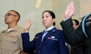 WASHINGTON – Senior Airman Deborah Vives, 11th Comptroller Squadron customer service technician, takes the Oath of Allegiance during a naturalization ceremony held at the Smithsonian National Museum of American History here June 14. This naturalization ceremony was in celebration of Flag Day 2011 and featured guest speaker Gerda Weissmann Klein, Holocaust survivor, naturalized citizen and founder of Citizenship Counts. (U.S. Air Force photo by Airman 1st Class Bahja J. Jones)