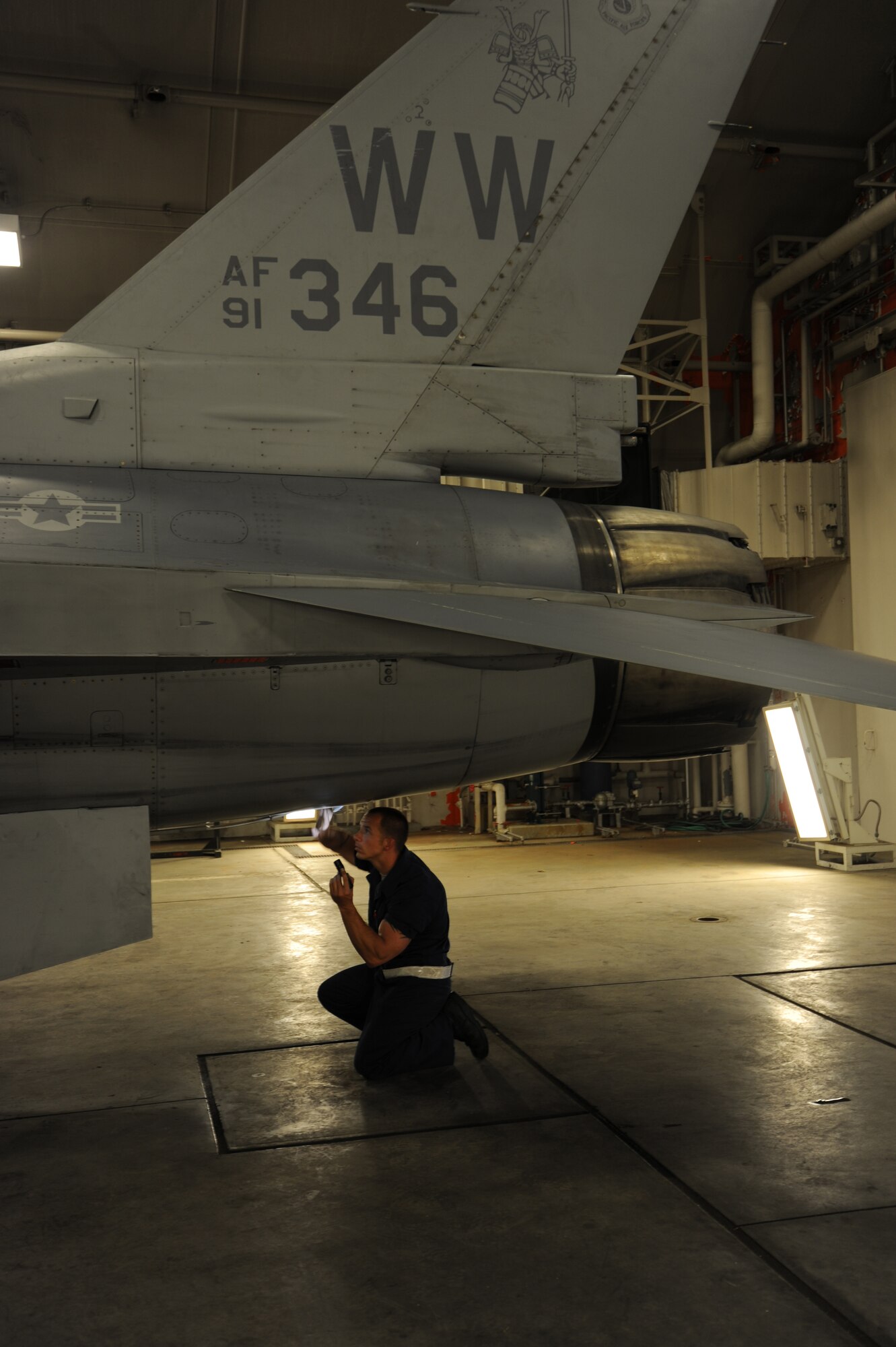MISAWA AIR BASE, Japan -- Staff Sgt. Donald Slayton, 35th Maintenance Squadron, 13th Aircraft Maintenance Unit crew chief, performs final checks on an F-16 Fighting Falcon before approving it as operationally ready to fight June 15.  To maintain operational readiness, crew chiefs conduct routine inspections on the jet. (U.S. Air Force photo/Staff Sgt. April Quintanilla)